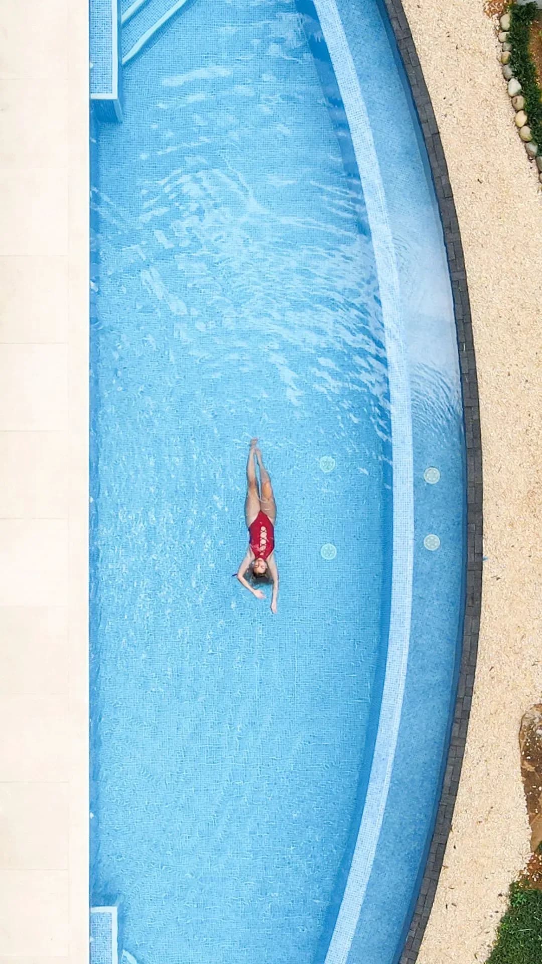 The infinity pool and coast at golden hour